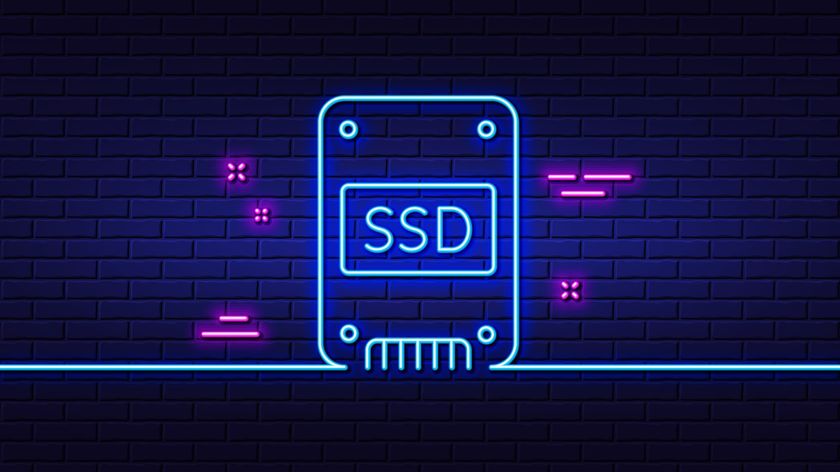 Neon artwork of a stylised SSD against a brick wall.