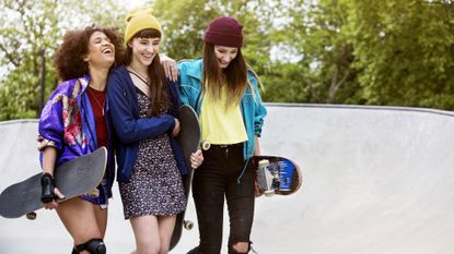 Group of skateboarders laughing together