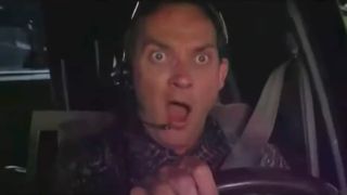 Zach Grenier yells in surprise while behind the wheel in Twister.