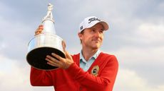 Russell Henley with the Arnold Palmer Invitational trophy