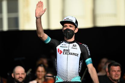 Simon Yates waves to the crowd at Giro d'Italia 2021 team presentation