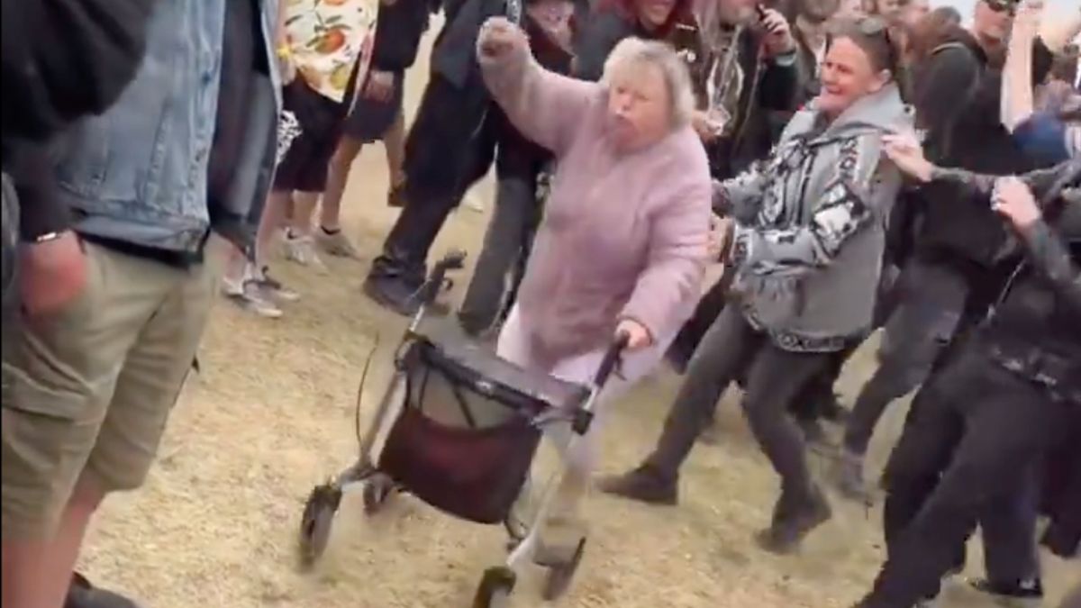 A woman with a stroller in a moshpit