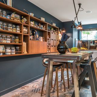 kitchen with blue walls and wooden cabinets