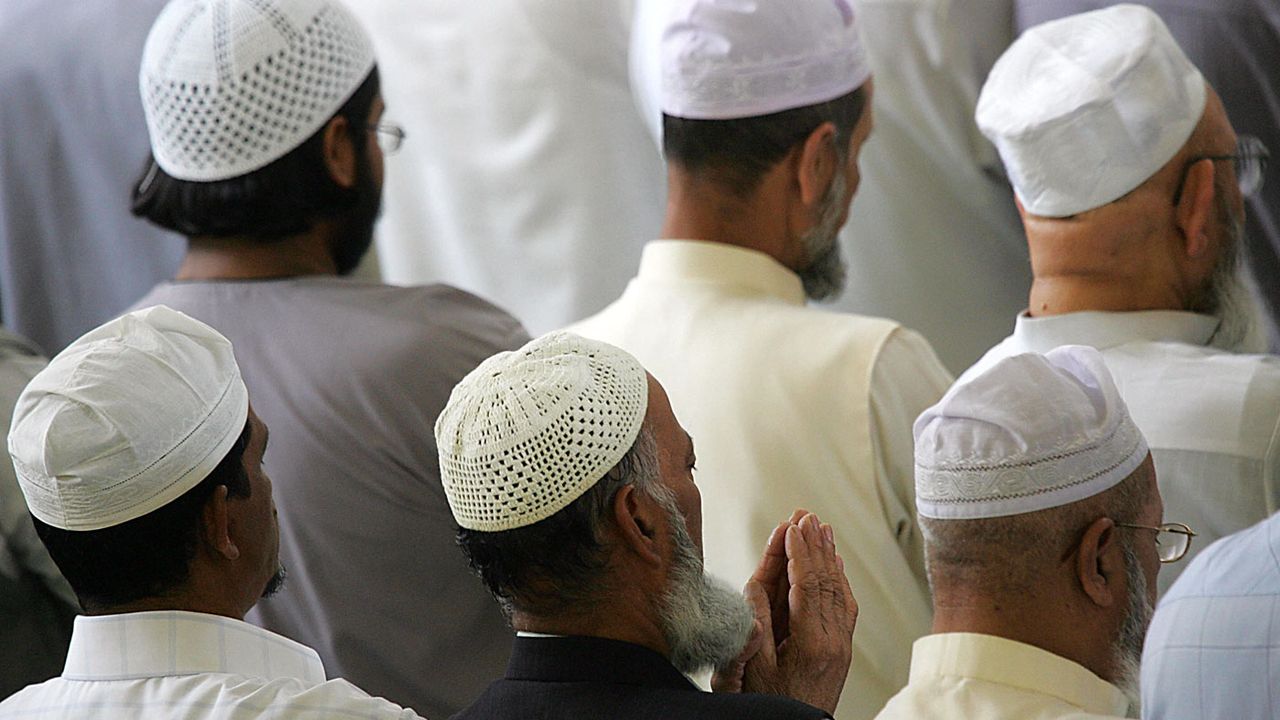 Muslim men praying