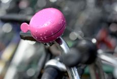 A bike bell on a handlebar
