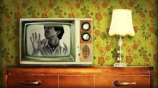 Young Man In Retro Styled Television Set