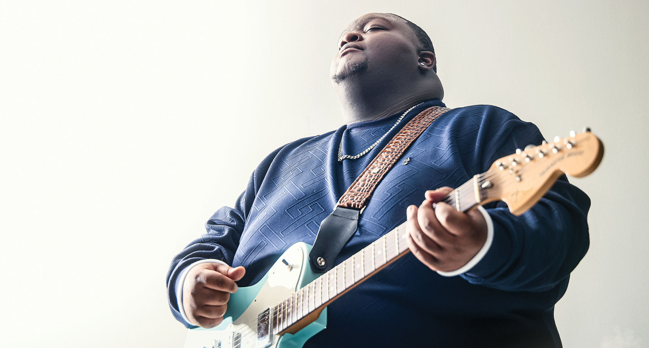 Christone Kingfish Ingram wears a blue sweat and plays his new signature Telecaster in Delta Day