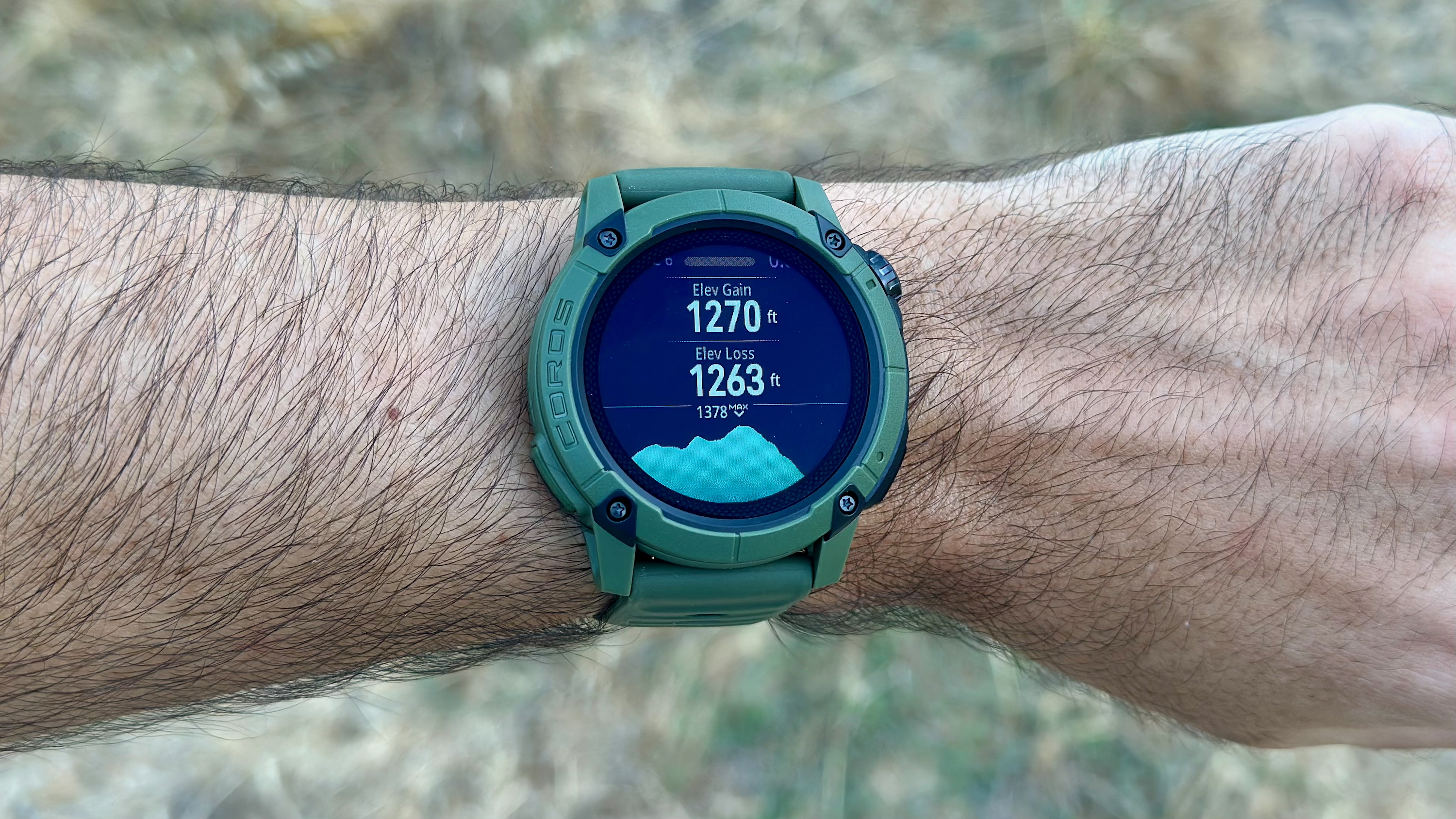 The COROS NOMAD watch showing a post-hike workout summary with elevation data.