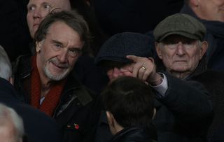 Manchester United investor Sir Jim Ratcliffe of INEOS talks to Sir Alex Ferguson in the directors box ahead of the Premier League match between Manchester United and Tottenham Hotspur at Old Trafford on January 14, 2024 in Manchester, England.