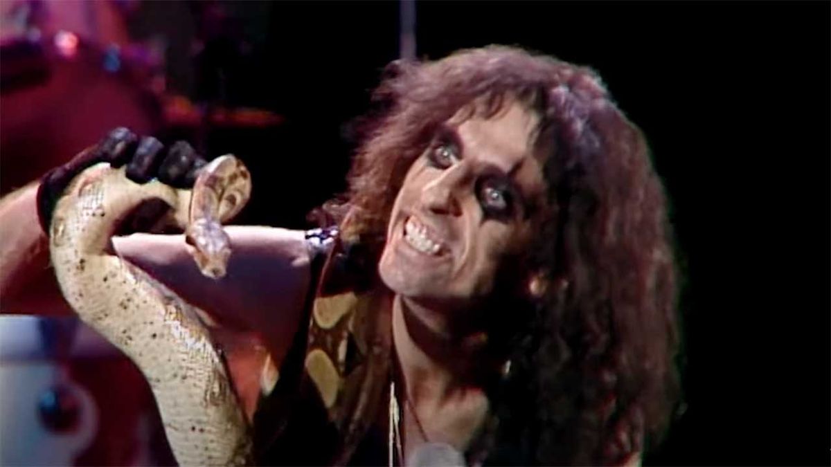 Alice Cooper and snake onstage