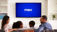 Max logo on a television screen in front of a family