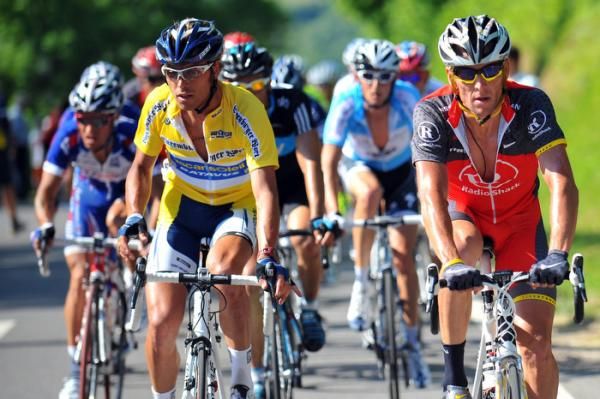 Yellow jersey Matteo Carrera (Vacansoleil) rides next to Lance Armstrong.