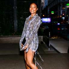 Gabrielle Union poses in short dress at night time. 