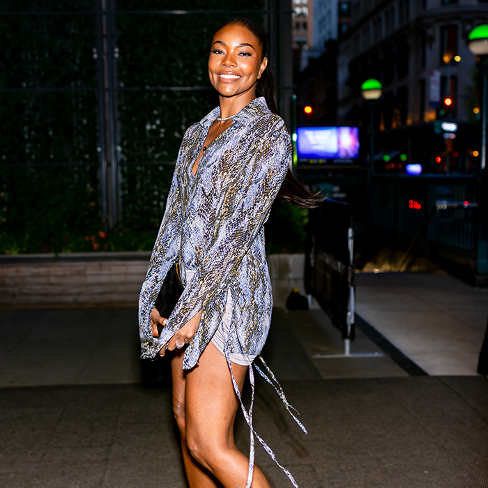 Gabrielle Union poses in short dress at night time. 