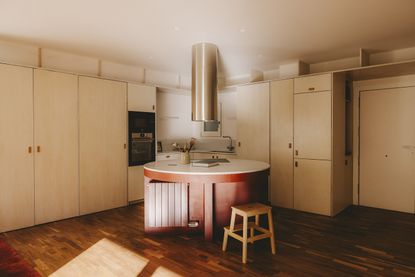 interior views of warm Barcelona apartment in red and neutral tones