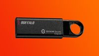 The Buffalo RUF3-KEV USB drive on a red-orange gradient