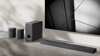 Render of LG S95QR soundbar with speakers and sub beneath a TV screen