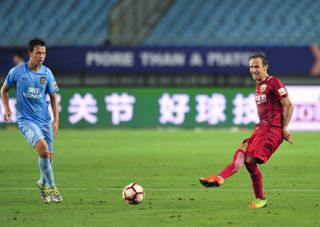 Ricardo Carvalho (right) in action for Shanghai SIPG against Jiangsu Suning in July 2017.