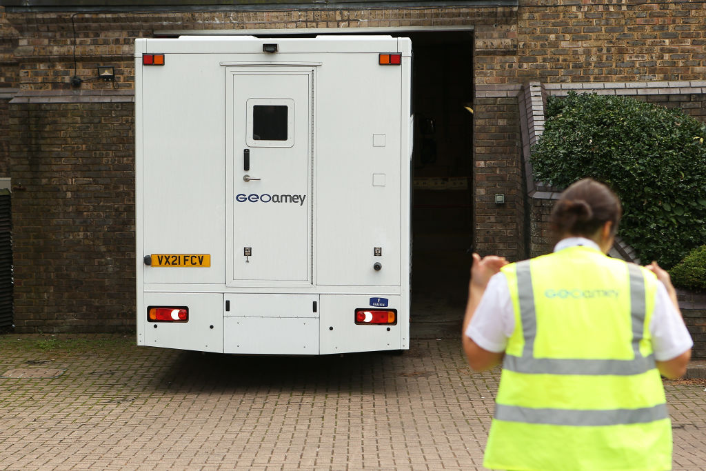 Prison officers guide a van containing Benjamin Mendy outside Chester magistrate's court.