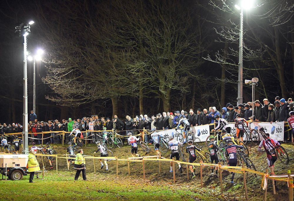 The men's field navigates an off-camber section