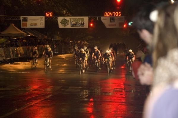 Riders pass through the start line - only halfway there.