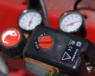 controls and gauge on an air compressor