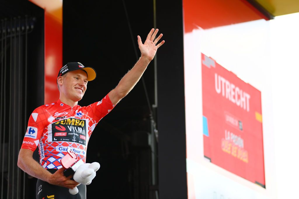UTRECHT NETHERLANDS AUGUST 20 Mike Teunissen of Netherlands and Team Jumbo Visma celebrates winning the Red Leader Jersey on the podium ceremony after the 77th Tour of Spain 2022 Stage 2 a 1751km stage from sHertogenbosch to Utrecht LaVuelta22 WorldTour on August 20 2022 in Utrecht Netherlands Photo by Tim de WaeleGetty Images
