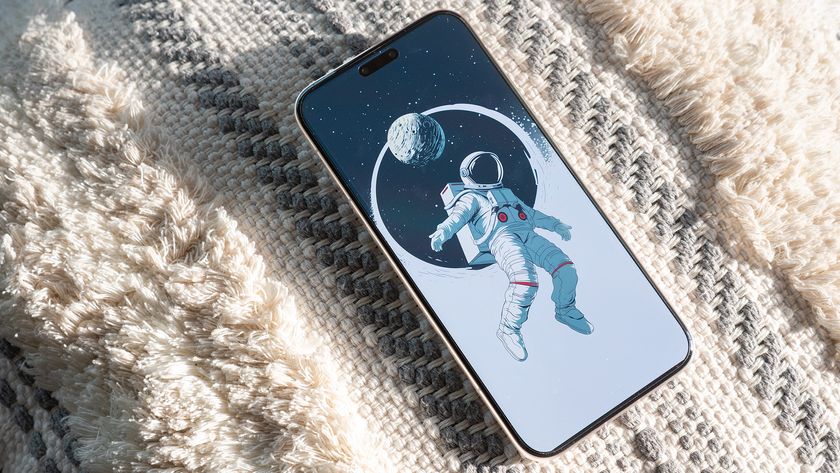 The Honor Magic 8 Pro with a space wallpaper from the Backdrops app