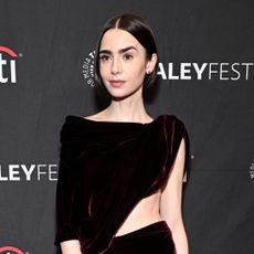 Emily in Paris star Lily Collins wears a Balenciaga cut-out dress with high-vamp heels