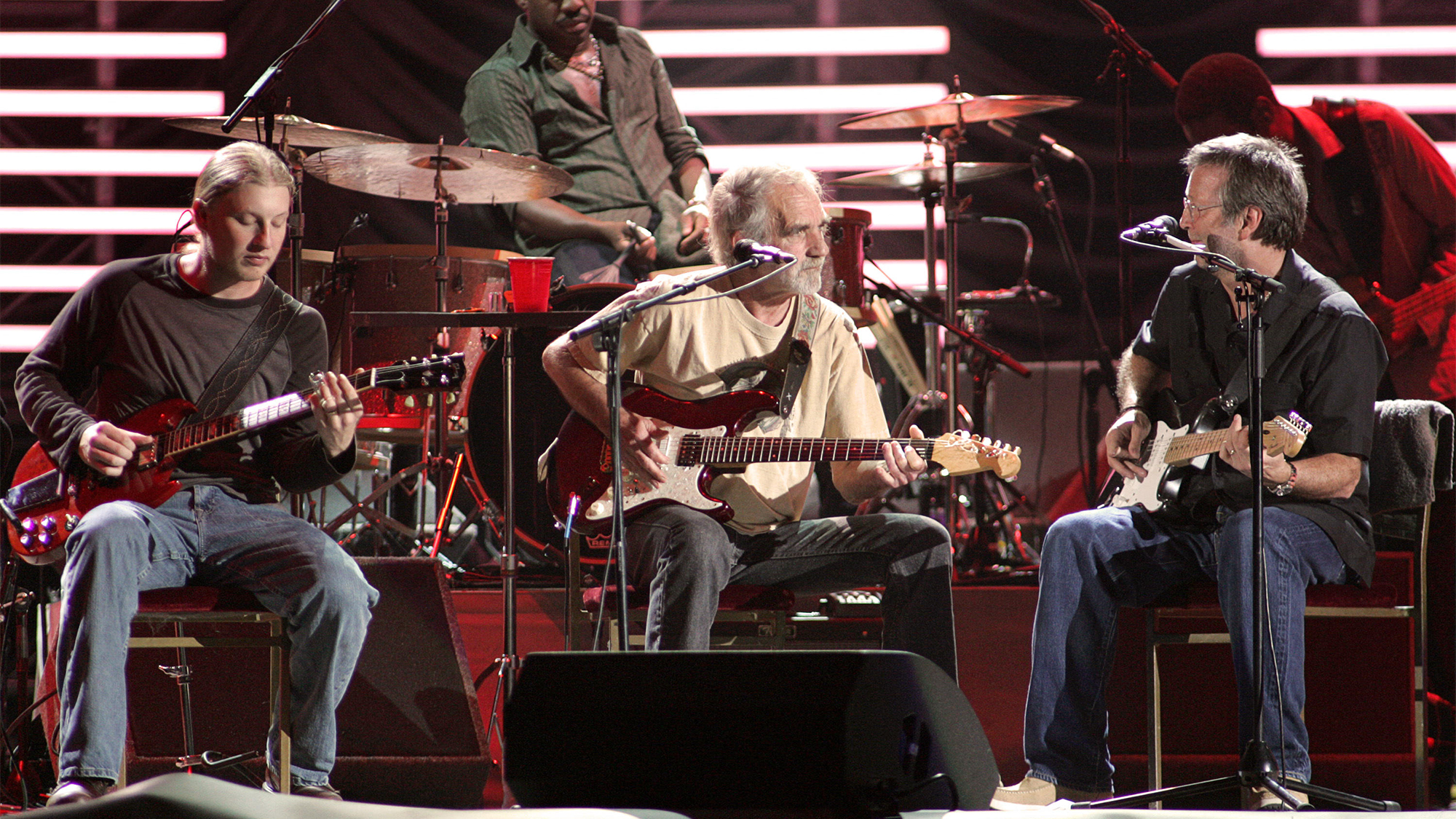 (from left) Derek Trucks, J.J. Cale and Eric Clapton perform in concert at the ipayOne Center in San Diego on March 15, 2007.