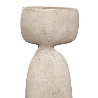 A neutral ceramic sculptural vase