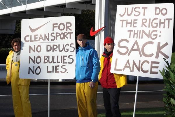 Protesters picket in front of the Nike World Headquarters campus in Beaverton, Oregon, on Oct. 16, 2012