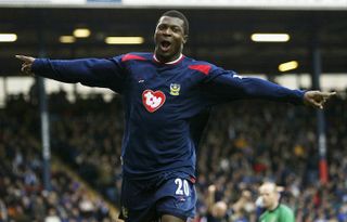 Yakubu celebrates after scoring for Portsmouth against Blackburn Rovers in March 2004.