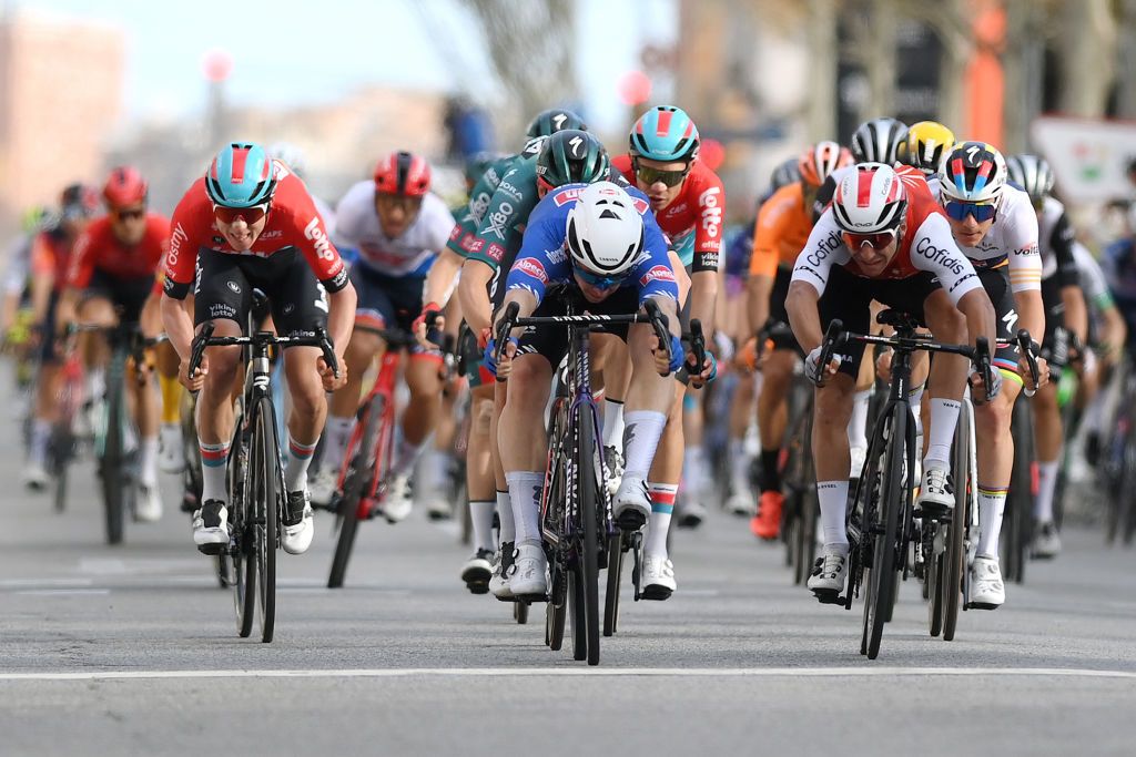 MOLINS DE REI SPAIN MARCH 25 EDITORS NOTE Alternate crop LR Maxim Van Gils of Belgium and Team Lotto Dstny Kaden Groves of Australia and Team AlpecinDeceuninck and Bryan Coquard of France and Team Cofidis sprint at finish line during the 102nd Volta Ciclista a Catalunya 2023 Stage 6 a 1741km stage from Martorell to Molins de Rei UCIWT on March 25 2023 in Molins de Rey Spain Photo by David RamosGetty Images