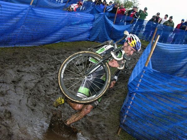 Tim Johnson splashes down in the mud.