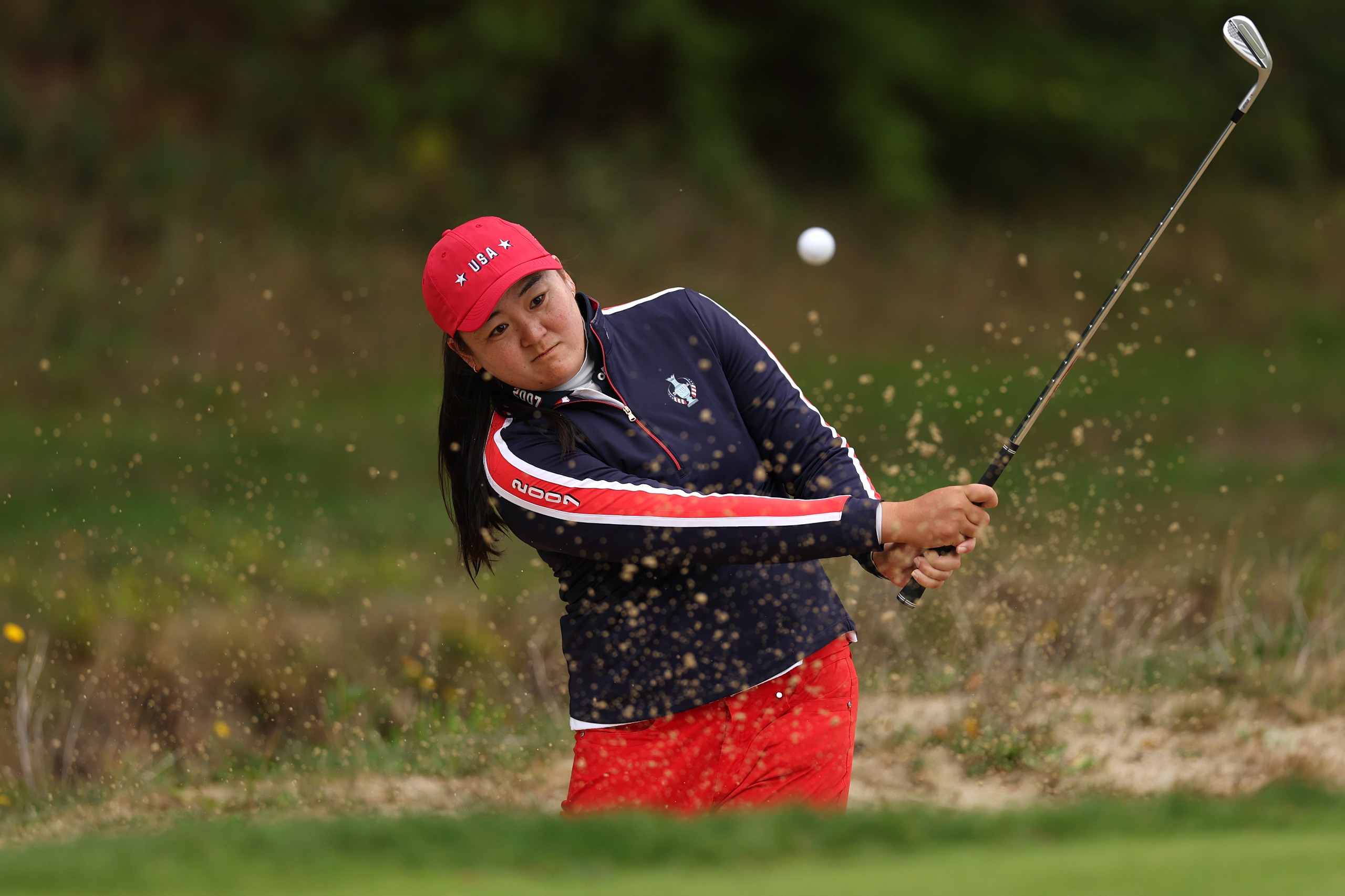Allisen Corpuz hitting a bunker shot in a practice round at the Solheim Cup 2026