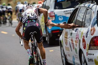 A Jelly Belly rider drops back to the team car for bottles