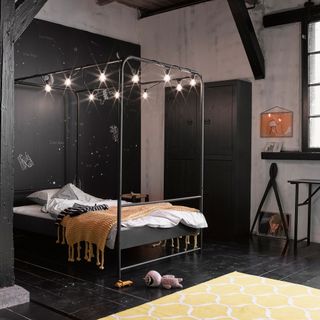 black painted floorboards in a modern bedroom