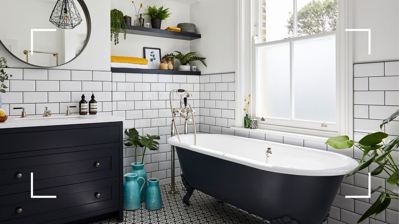 picture of bathroom with black and white bathtub 