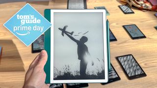 Kindle Scribe 2024 in hand with Tom's Guide Prime Day badge
