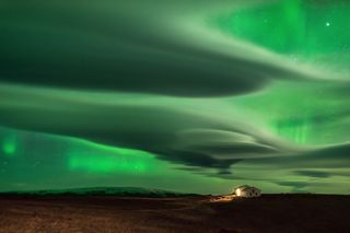 The auroras are best seen during the winter, when nights are long. Hours of patience by photographer Daniele Boffelli resulted in this image that captures both clouds and auroras in the night sky.