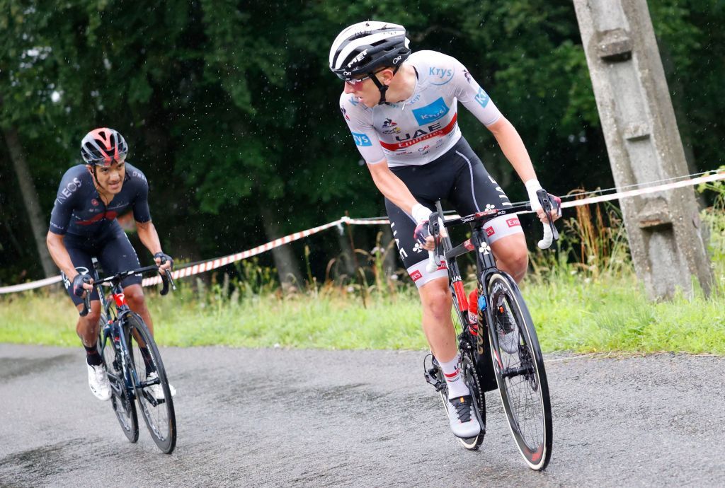 Team UAE Emirates Tadej Pogacar of Slovenia wearing the best youngs white jersey R looks at Team Ineos Grenadiers Richard Carapaz of Ecuador during the 8th stage of the 108th edition of the Tour de France cycling race 150 km between Oyonnax and Le GrandBornand on July 03 2021 Photo by Thomas SAMSON AFP Photo by THOMAS SAMSONAFP via Getty Images