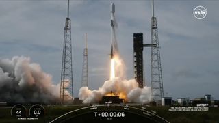 a black-and-white spacex falcon 9 rocket launches into a cloudy sky.