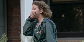 Millicent Simmonds covers her mouth in fright in A Quiet Place Part II.