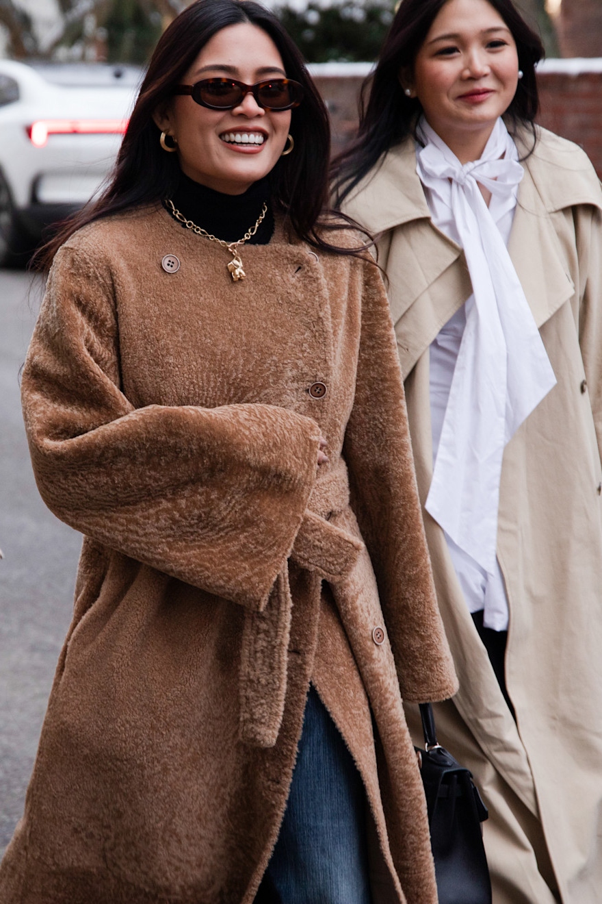 woman wearing a teddy coat and jeans