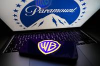 Paramount logo displayed on a laptop screen and Warner Bros logo displayed on a phone screen are seen in this illustration photo taken in Krakow, Poland on February 28, 2026. (Photo by Jakub Porzycki/NurPhoto)