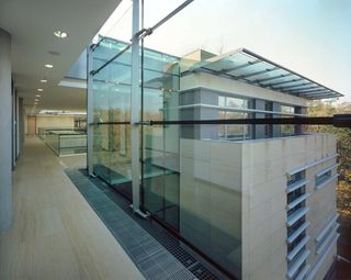 Upper floors of embassy with large glass panes as walls