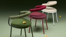 three S-CAB Koala outdoor chairs in green, red, and white