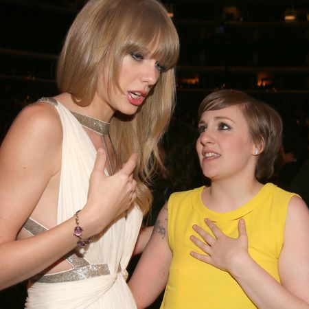 Taylor Swift wears a white Grecian cut-out dress and Lena Dunham wears a bright yellow gown