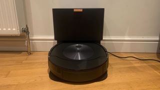 The rear of the iRobot Roomba Combo j7+, featuring a button to eject the dust bin and water tank.
